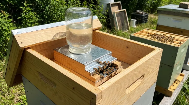 What are the benefits of using a top feeder in terms of preventing robber bees? Secure Your Hive's Resources